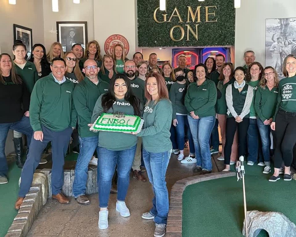 A company team celebrating an event at Old Town Putt
